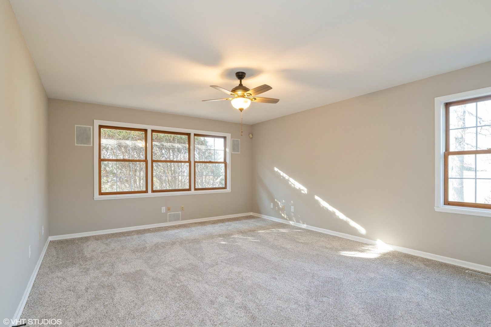 4818 5th Street Winthrop Harbor, IL 60096 - Photo 3 of 17 a view of a room with windows and chandelier fan