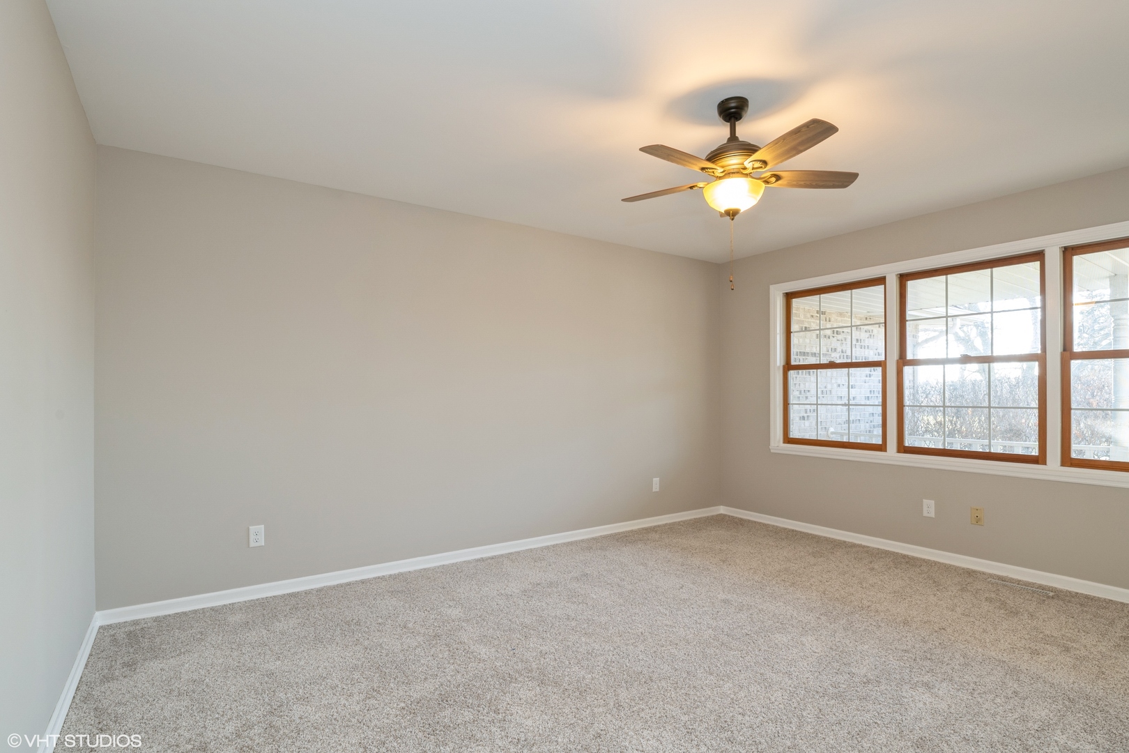 4818 5th Street Winthrop Harbor, IL 60096 - Photo 5 of 17 an empty room with a window and a fan