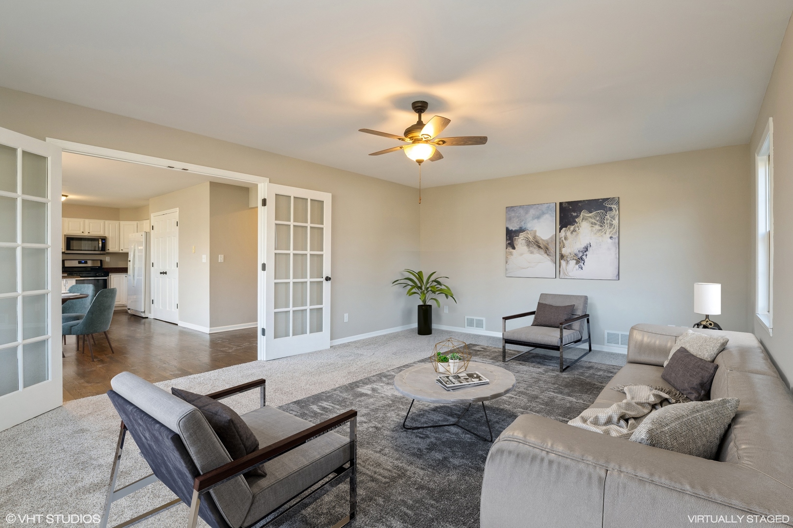 4818 5th Street Winthrop Harbor, IL 60096 - Photo 7 of 17 a living room with furniture a chandelier and a window