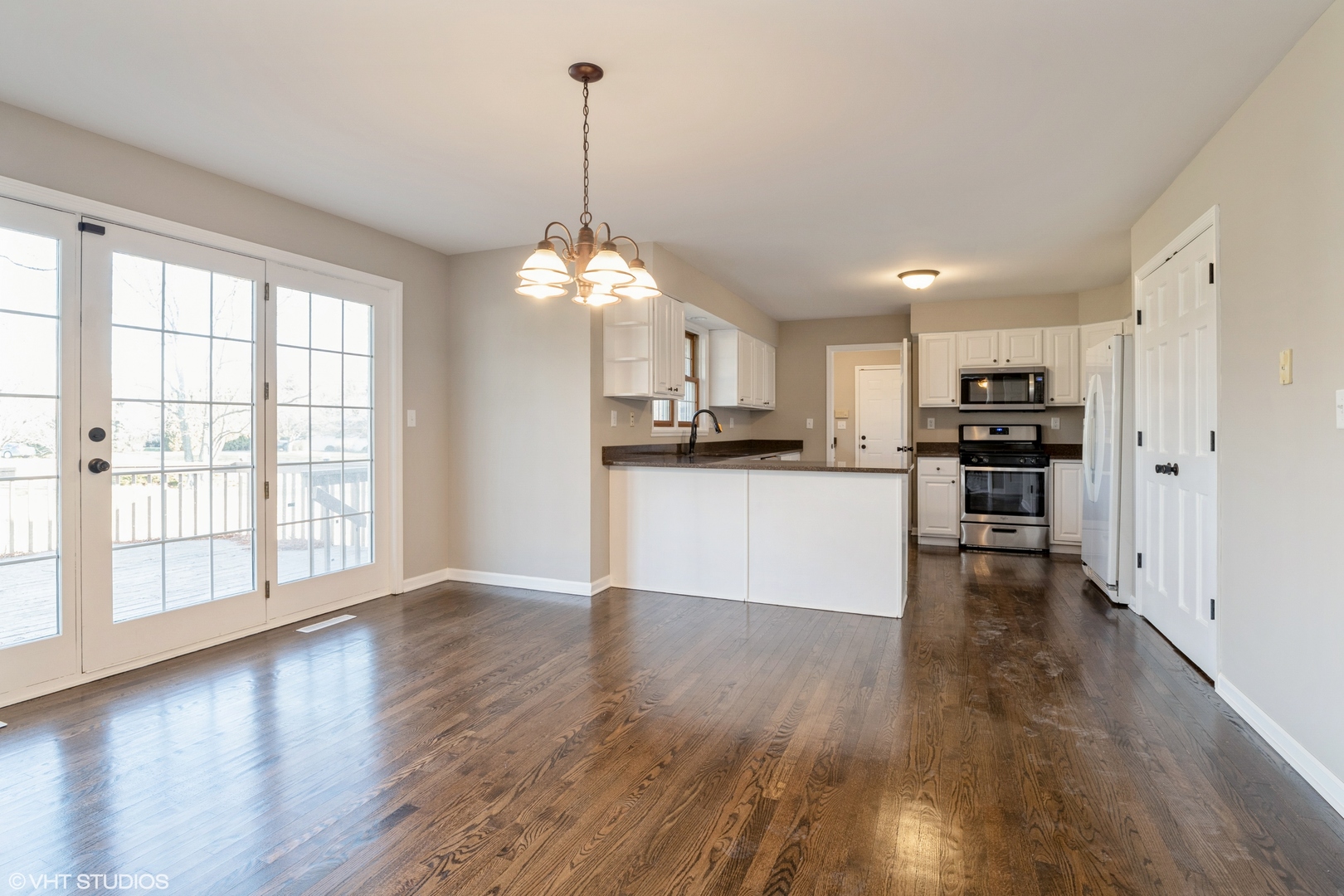 4818 5th Street Winthrop Harbor, IL 60096 - Photo 8 of 17 a view of a kitchen with microwave and wooden floor