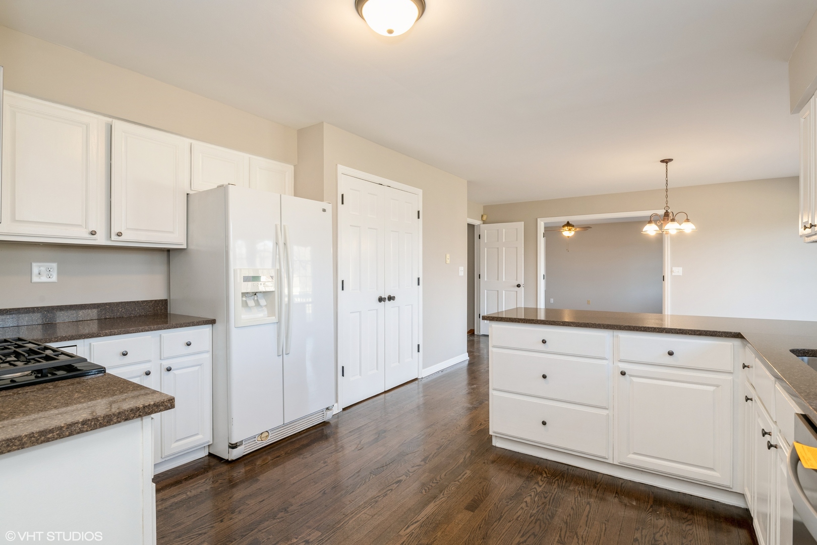 4818 5th Street Winthrop Harbor, IL 60096 - Photo 10 of 17 a kitchen with granite countertop white cabinets and white appliances