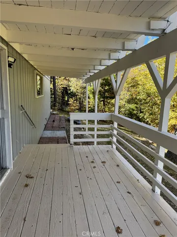a view of outdoor space with wooden floor