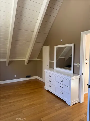 a living room with furniture and flat screen tv