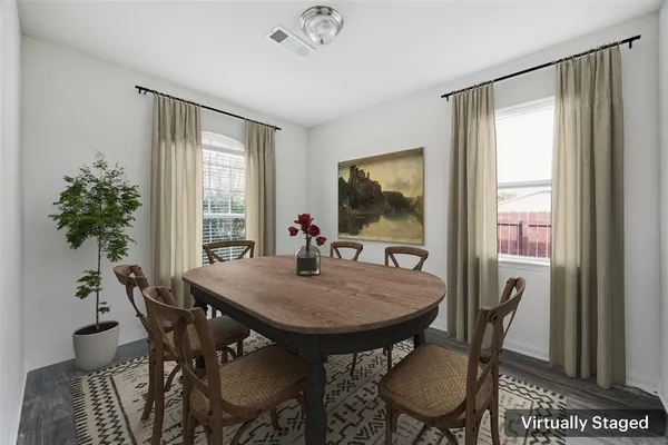 a view of a dining room with furniture window and wooden floor