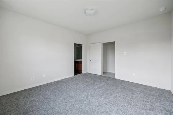 a view of an empty room and a window
