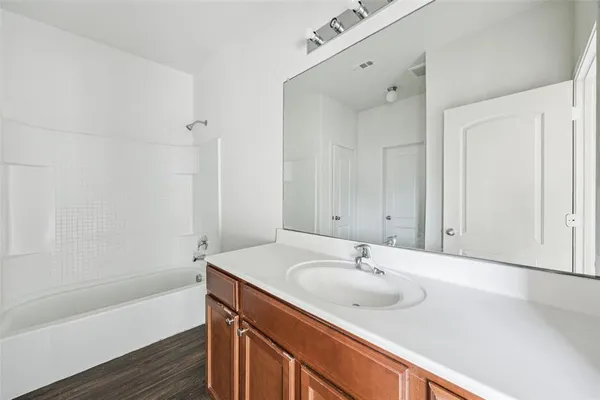 a bathroom with a sink and a bathtub