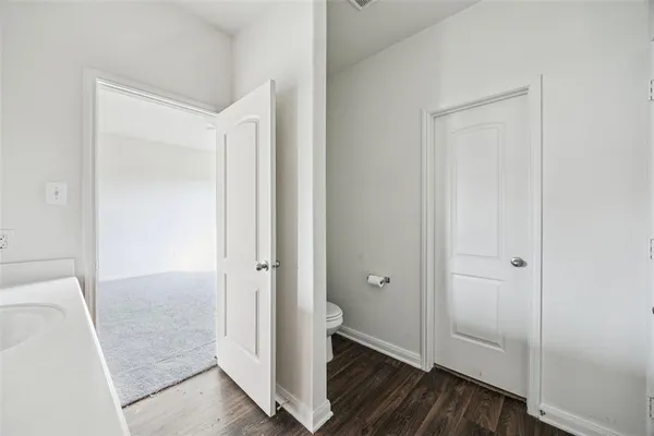 a view of hallway with wooden floor