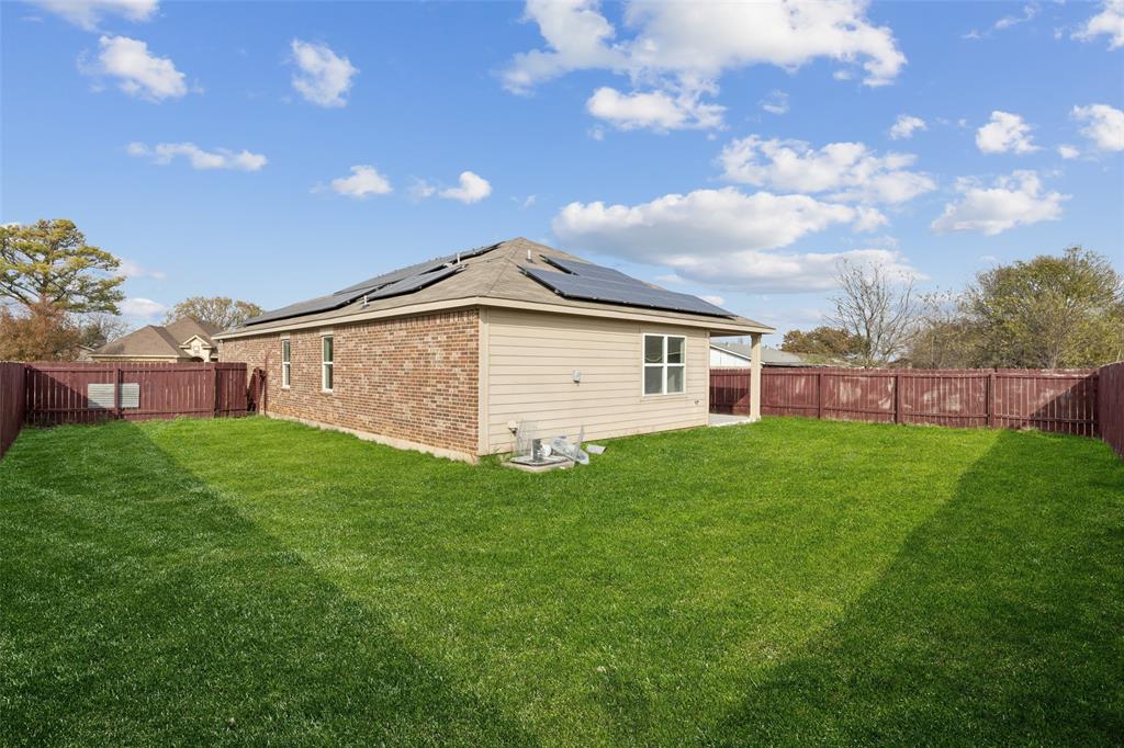1020 Walnut Ridge Drive Hutchins, TX 75141 - Photo 27 of 28 a view of a house with a backyard