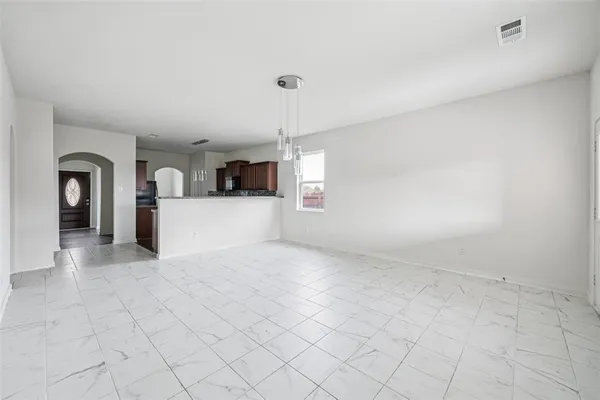 a view of a kitchen with furniture and window