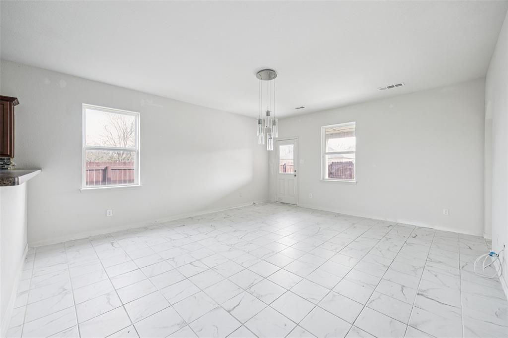 1020 Walnut Ridge Drive Hutchins, TX 75141 - Photo 5 of 28 an empty room with windows