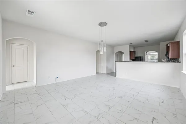 a view of a kitchen with furniture and a sink