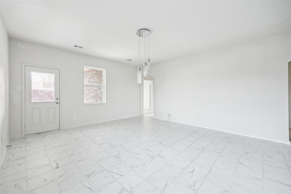 1020 Walnut Ridge Drive Hutchins, TX 75141 - Photo 7 of 28 an empty room with windows and fan