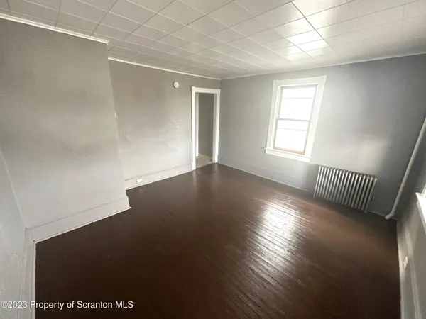 a view of a kitchen with furniture and a sink
