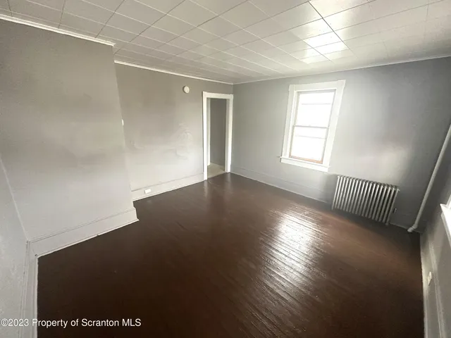 a view of a kitchen with furniture and a sink