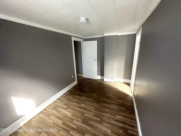 a bathroom with a sink mirror vanity and toilet