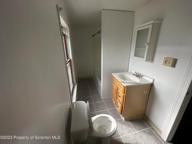a utility room with sink dryer and washer