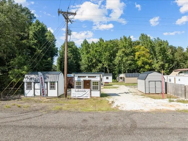 an aerial view of a house with a lake view