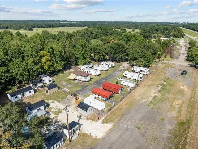 a view of a swimming pool with a yard
