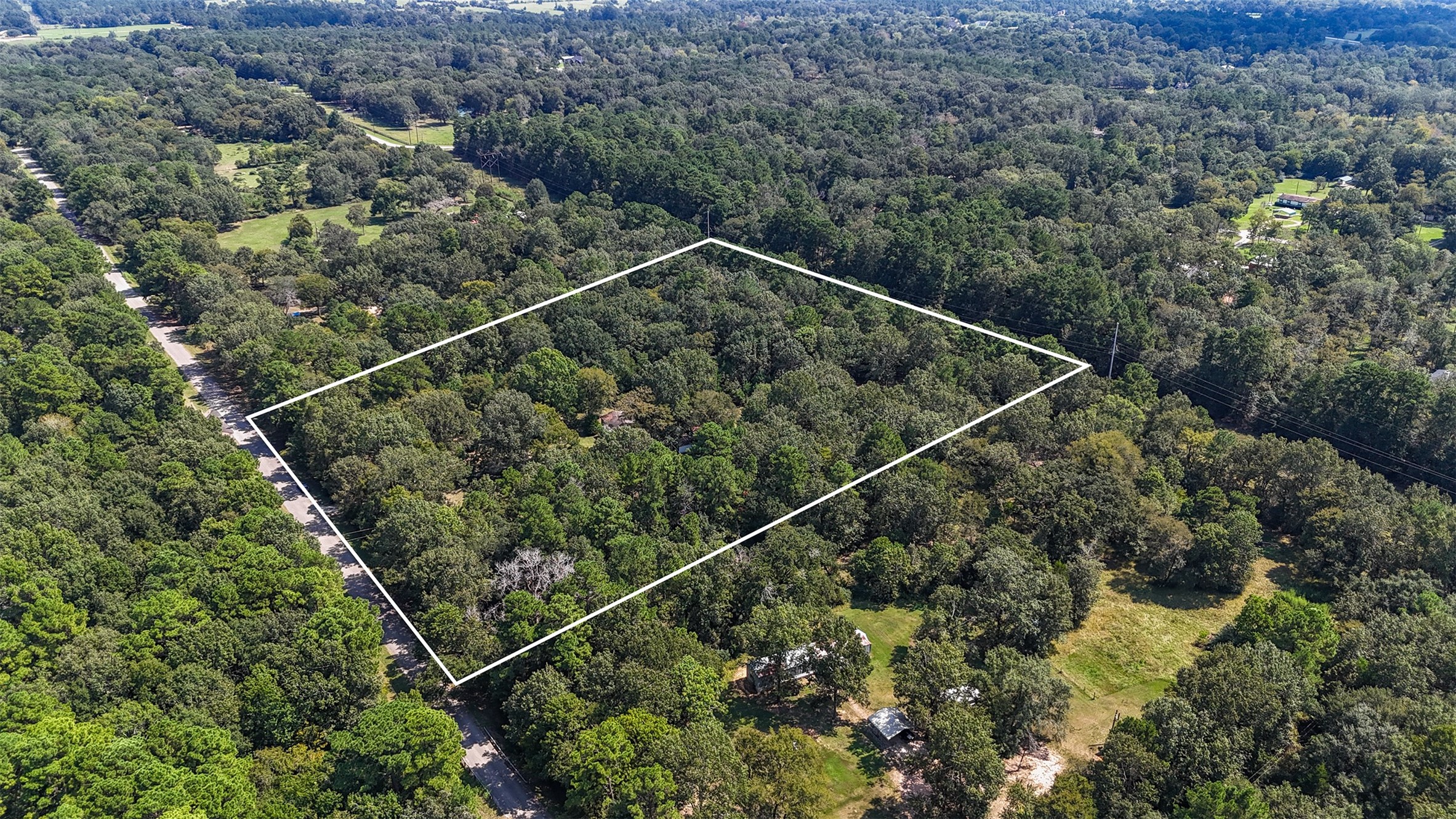 a aerial view of a house with a street