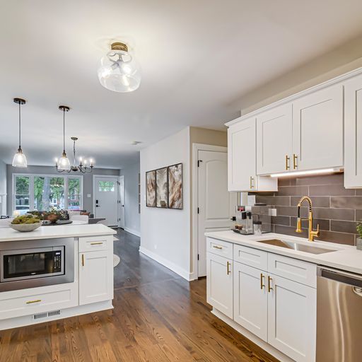 469 Northgate Court Riverside, IL 60546 - Photo 8 of 29 a kitchen with a sink stove and cabinets
