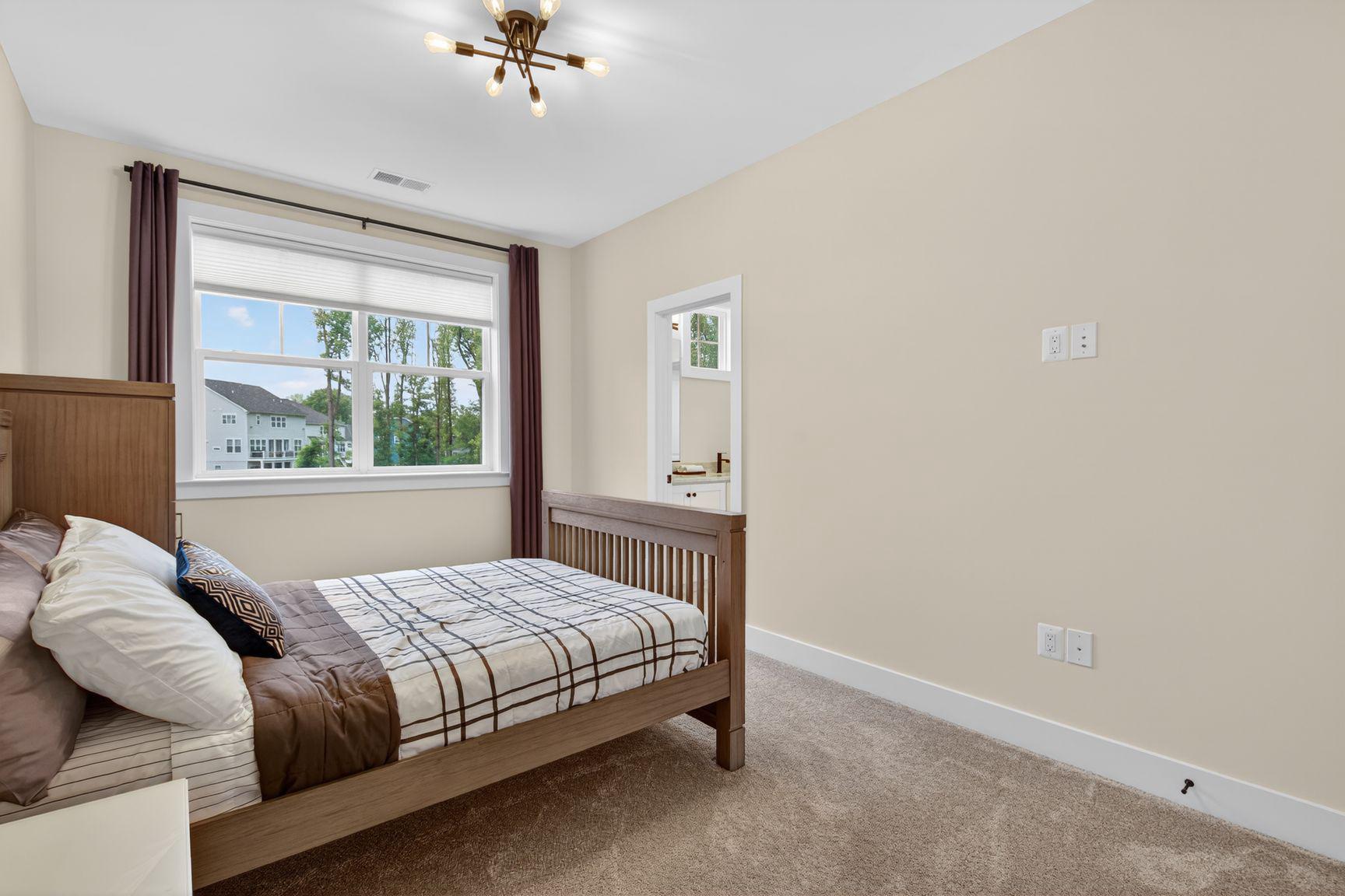6213 Mcconnell Lane Springfield, VA 22152 - Photo 26 of 39 a bedroom with a bed and window