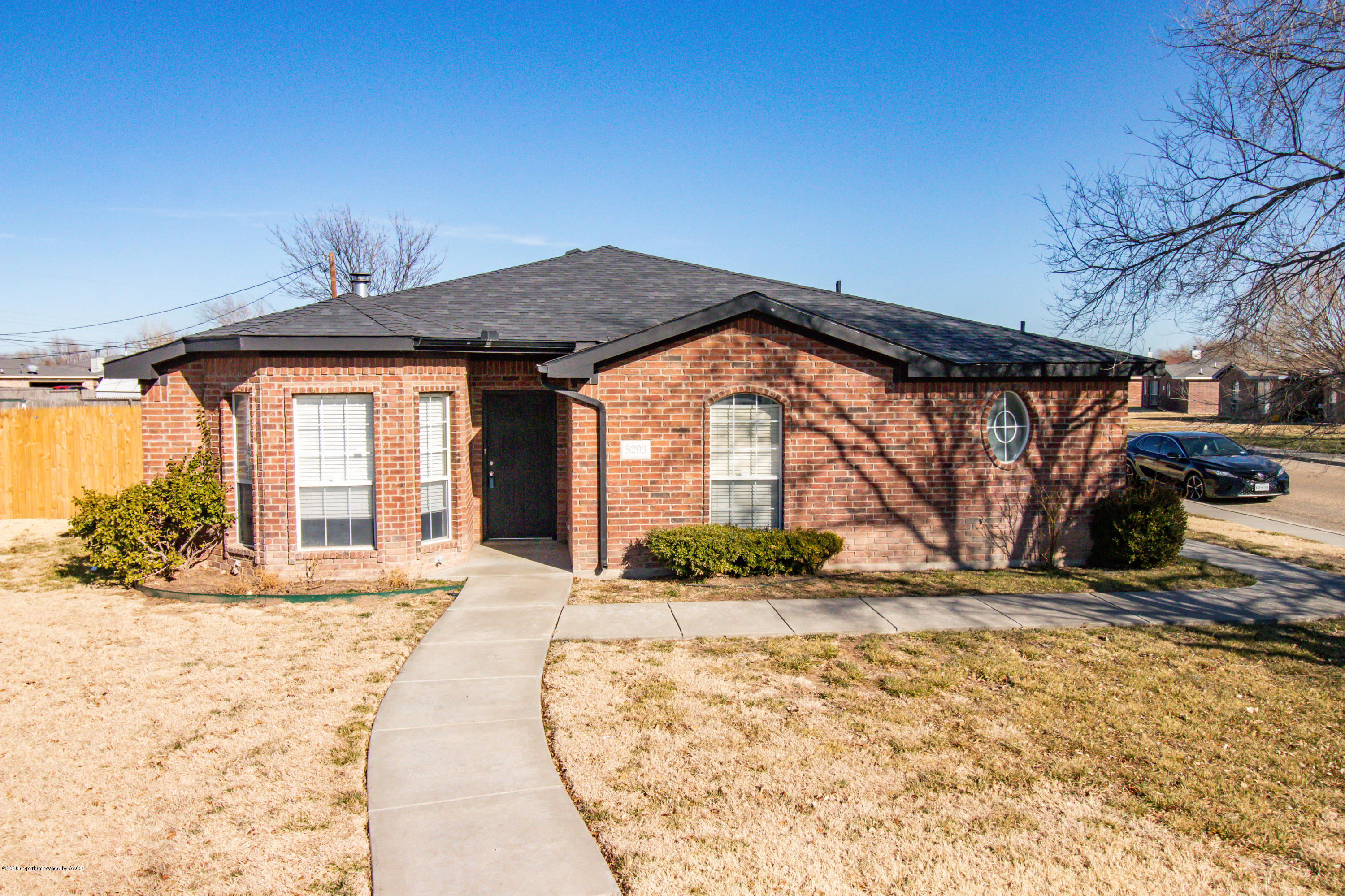 5203 Capulin Lane Amarillo, TX 79110 - Photo 1 of 29 a front view of a house with a yard