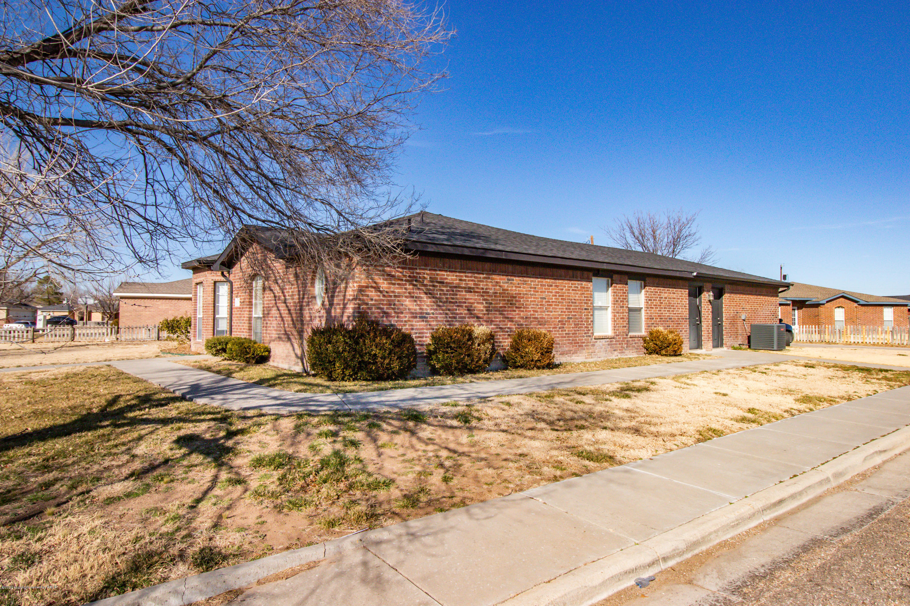 5203 Capulin Lane Amarillo, TX 79110 - Photo 2 of 29 a front view of a house with a yard