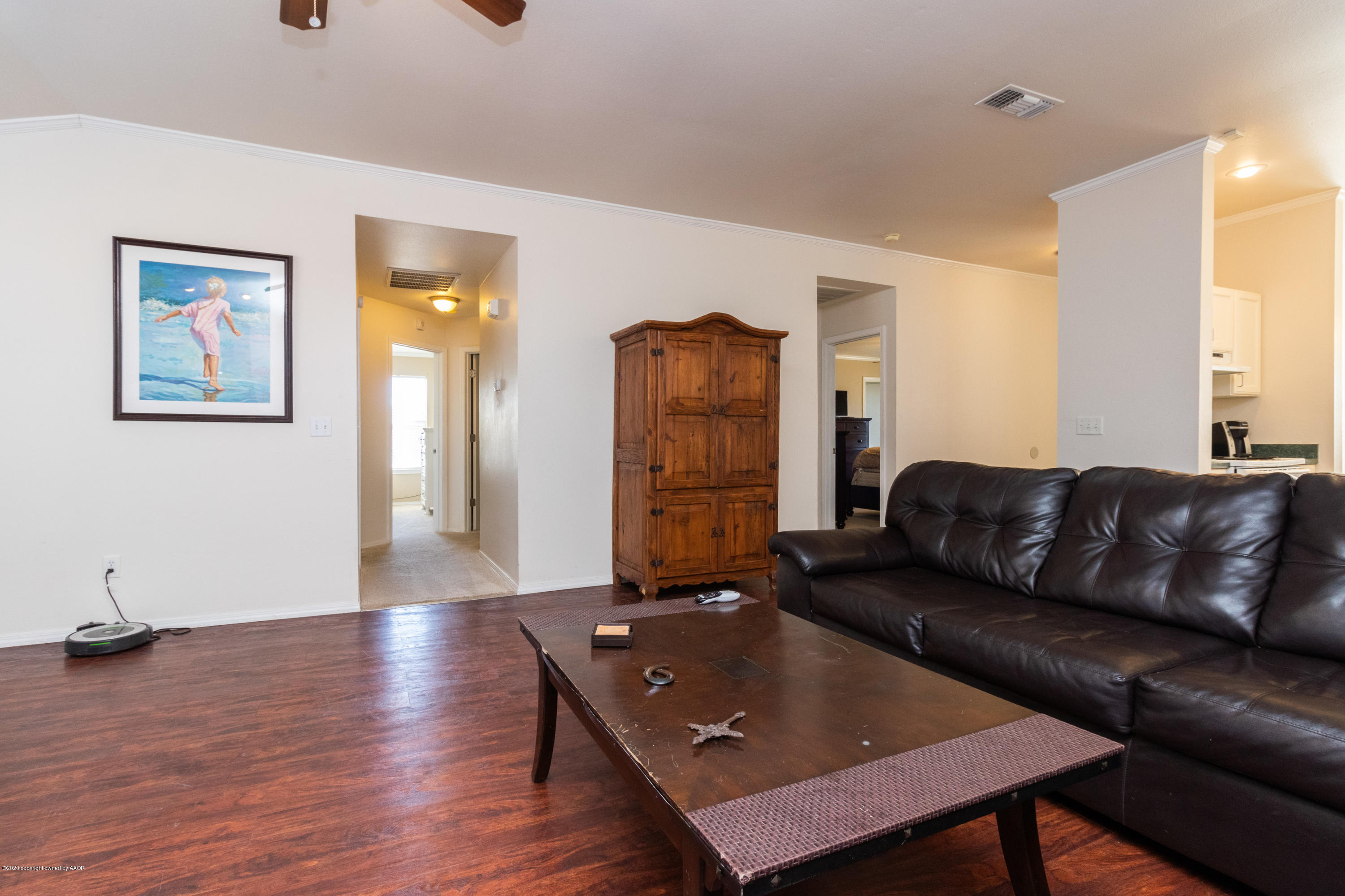 5203 Capulin Lane Amarillo, TX 79110 - Photo 13 of 29 a living room with furniture and wooden floor