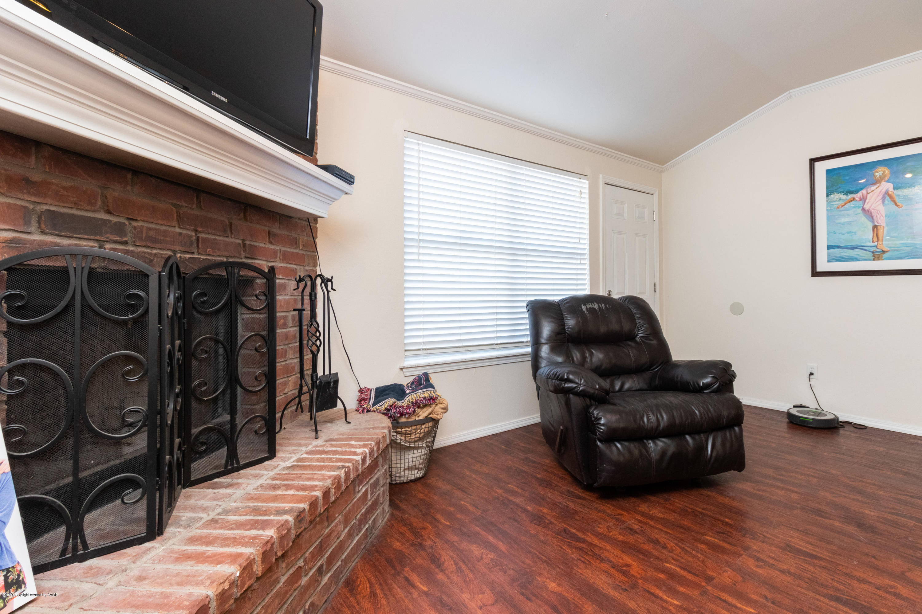 5203 Capulin Lane Amarillo, TX 79110 - Photo 14 of 29 a living room with furniture and a flat screen tv