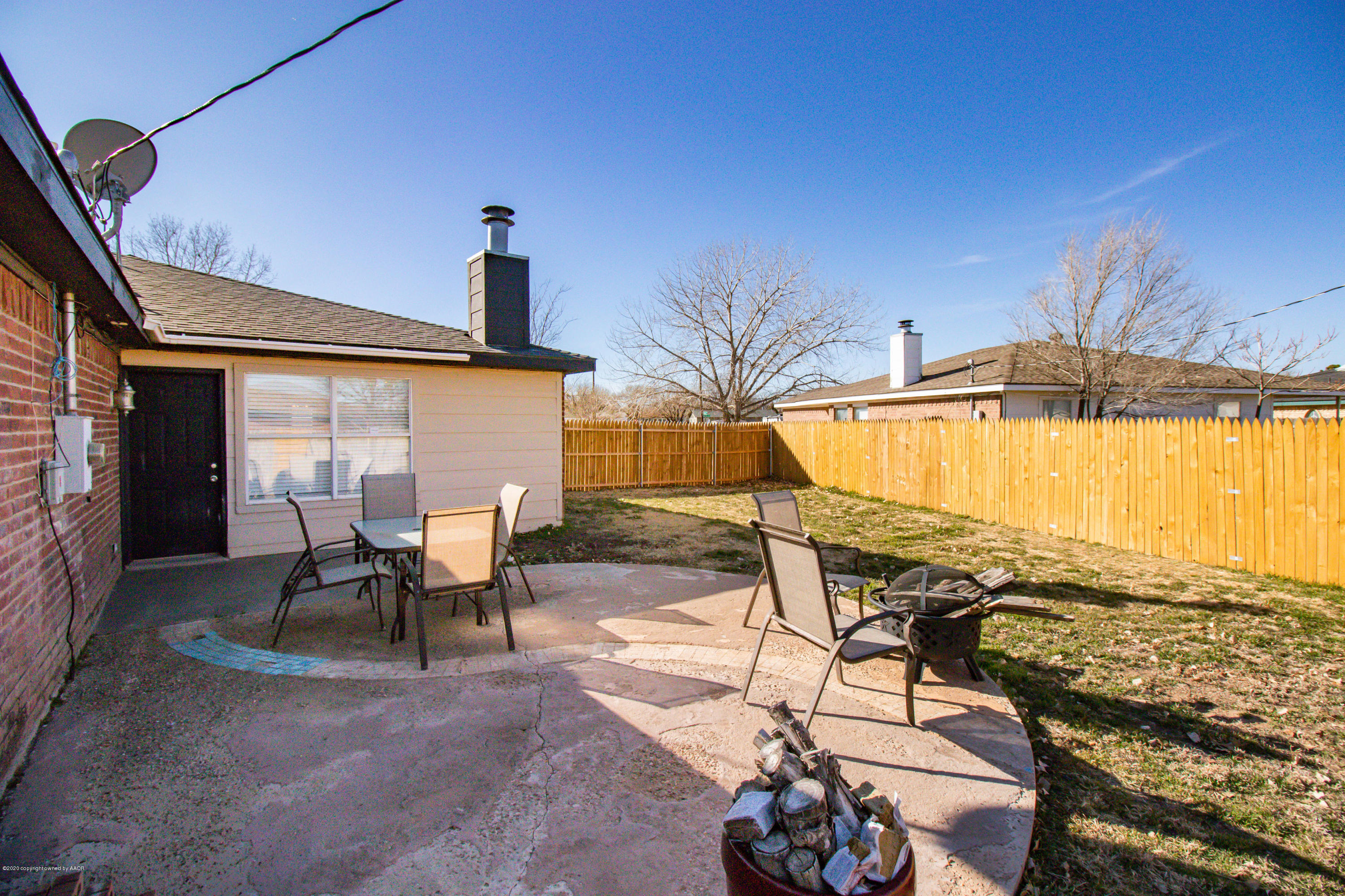 5203 Capulin Lane Amarillo, TX 79110 - Photo 28 of 29 a view of a swimming pool with a lounge chair