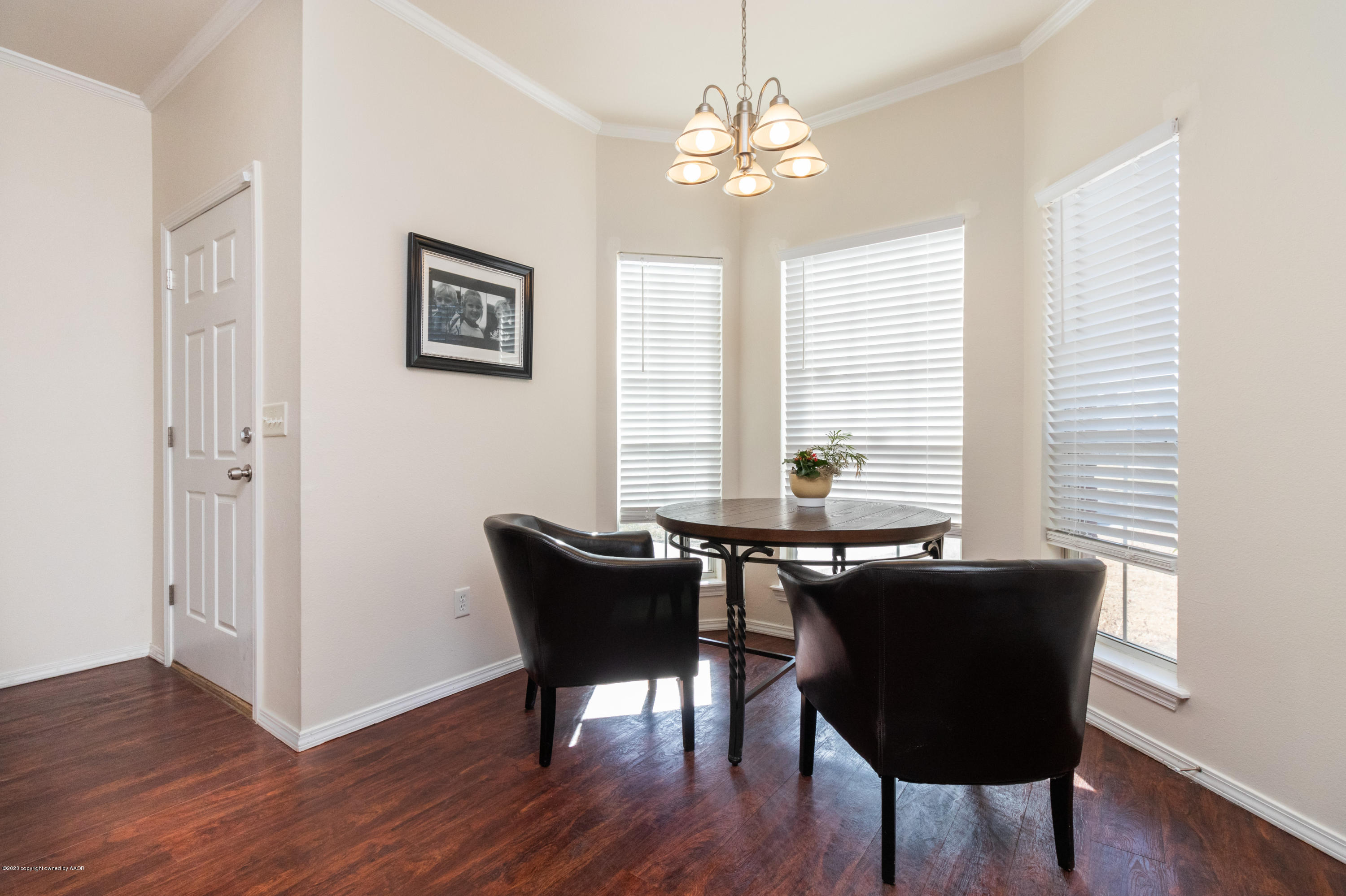 5203 Capulin Lane Amarillo, TX 79110 - Photo 5 of 29 a view of a dining room with furniture and wooden floor