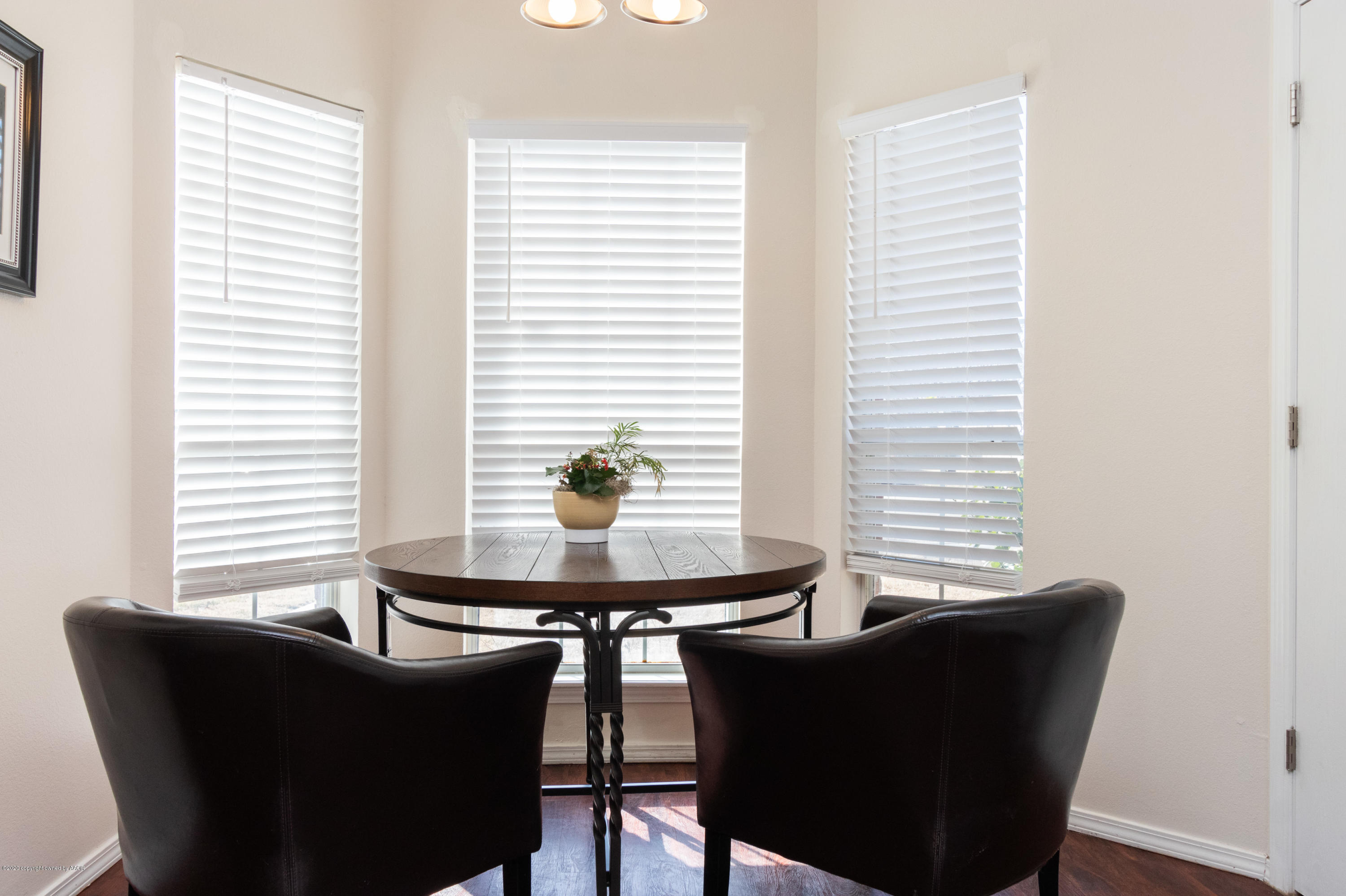 5203 Capulin Lane Amarillo, TX 79110 - Photo 6 of 29 a dining room with furniture and window