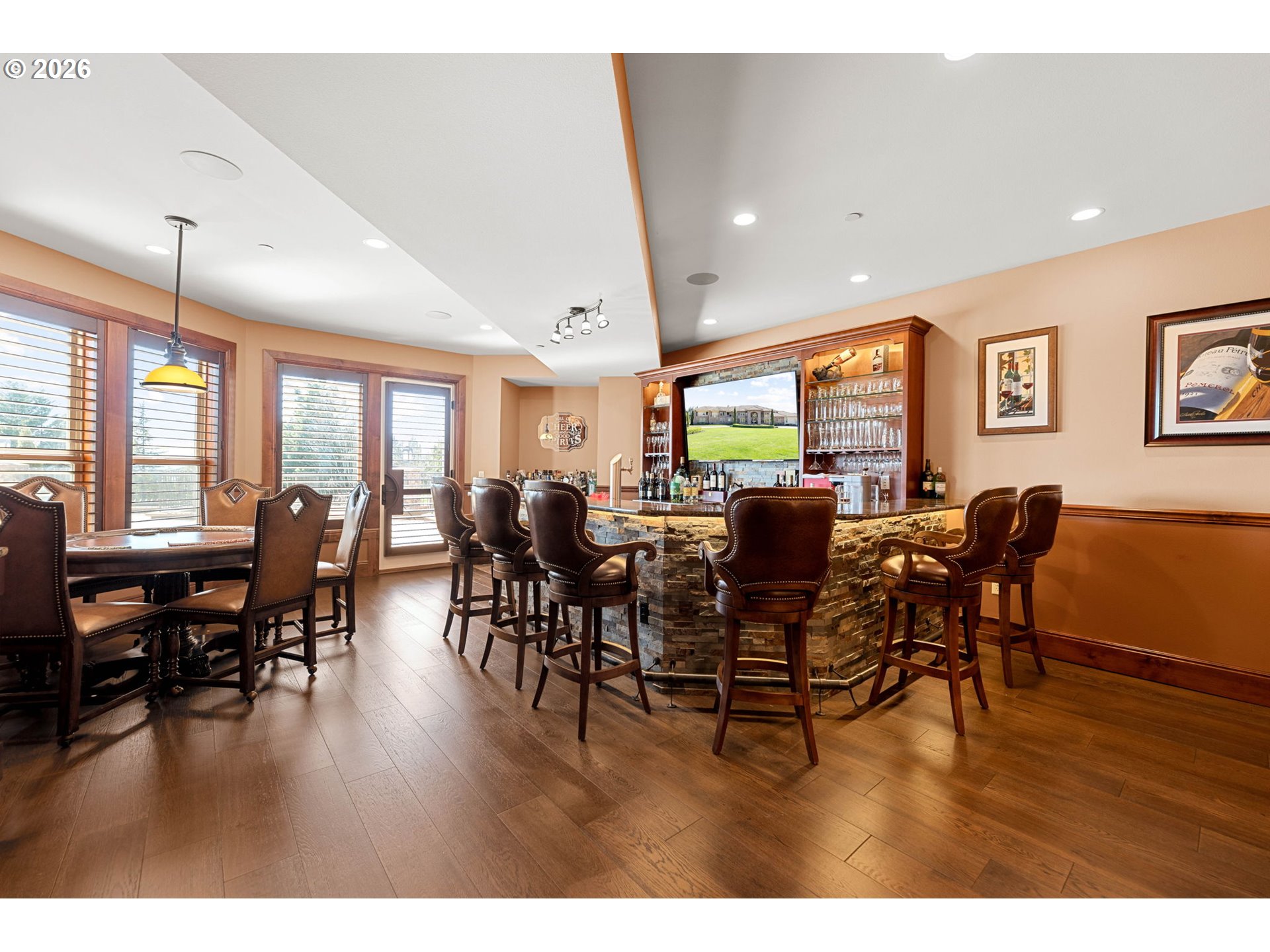1911 Northwest 206th Street Ridgefield, WA 98642 - Photo 15 of 31 a view of a dining room with furniture wooden floor and floor to ceiling window
