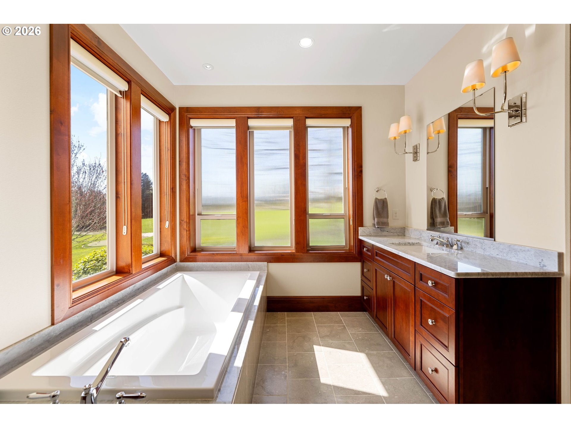 1911 Northwest 206th Street Ridgefield, WA 98642 - Photo 17 of 31 a large bathroom with a large tub and sink