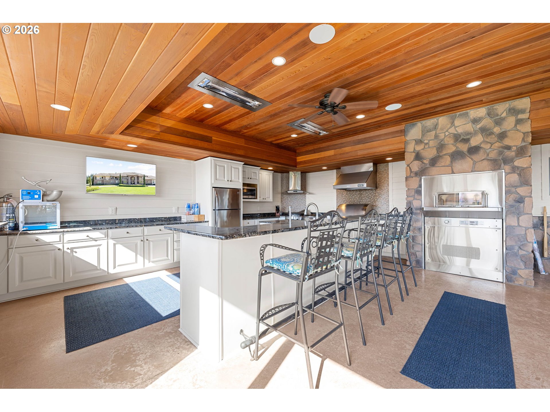 1911 Northwest 206th Street Ridgefield, WA 98642 - Photo 18 of 31 a view of a dining hall with furniture and a kitchen view