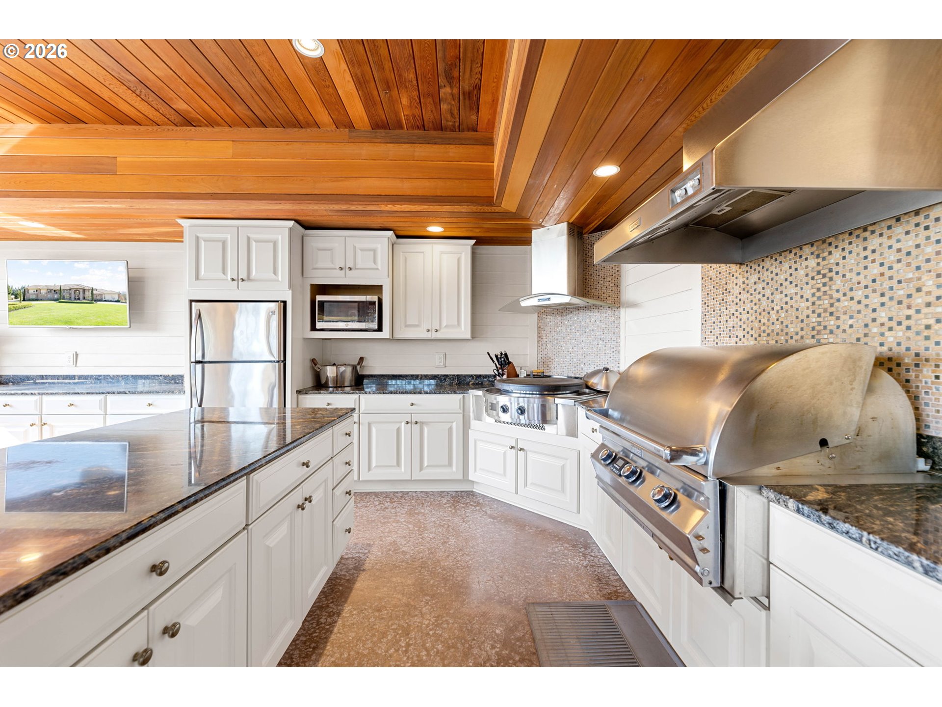 1911 Northwest 206th Street Ridgefield, WA 98642 - Photo 19 of 31 a kitchen with granite countertop a stove and cabinets