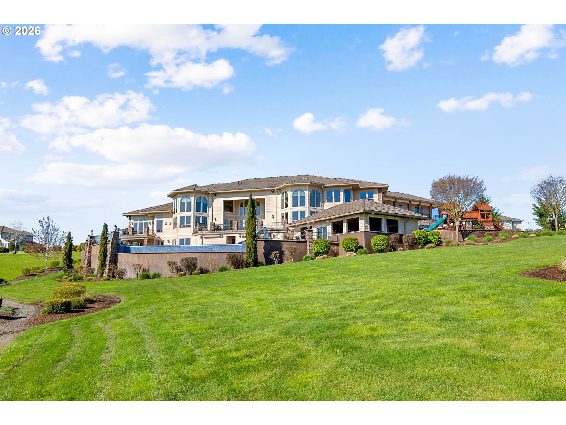 1911 Northwest 206th Street Ridgefield, WA 98642 - Photo 27 of 31 a view of a house with a big yard and large trees