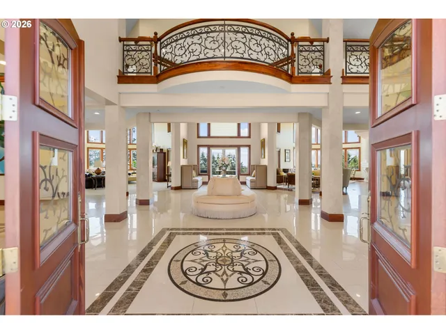 a view of living room and hallway with wooden floor