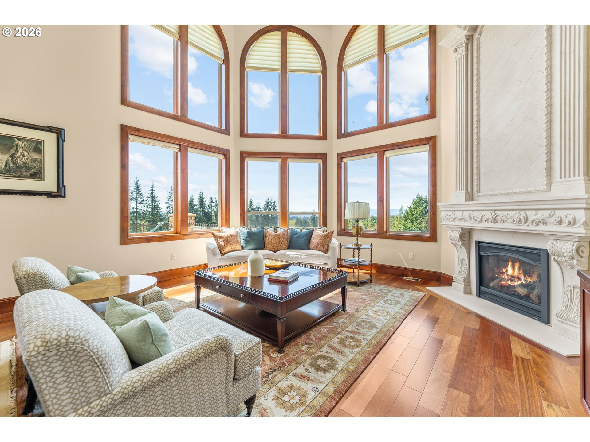 1911 Northwest 206th Street Ridgefield, WA 98642 - Photo 10 of 31 a living room with furniture a fireplace and a large window