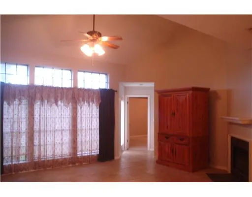 a view of a livingroom with furniture window and wooden floor