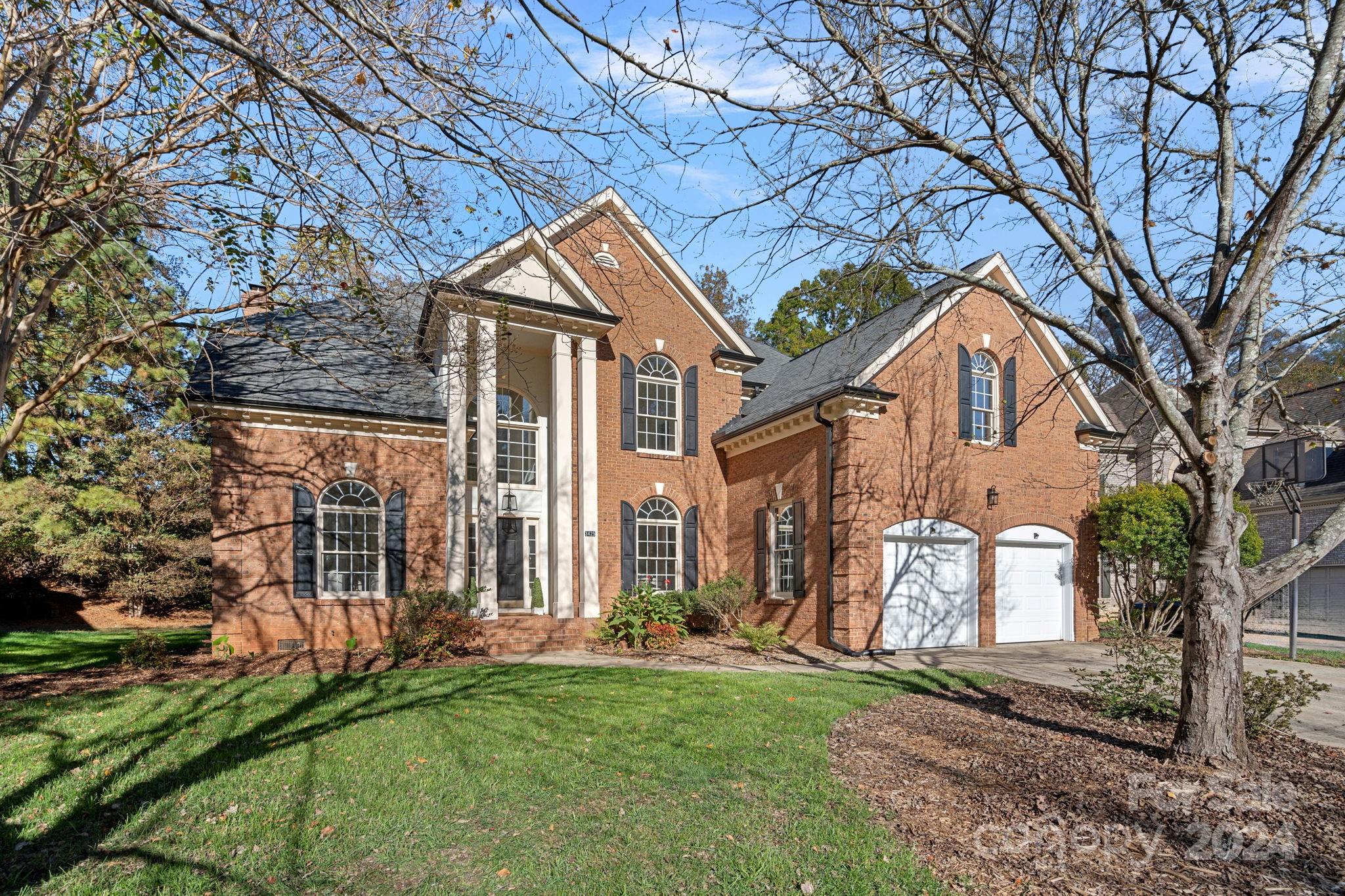 3425 Rhett Butler Place Charlotte, NC 28270 - Photo 1 of 48 a front view of a house with a yard