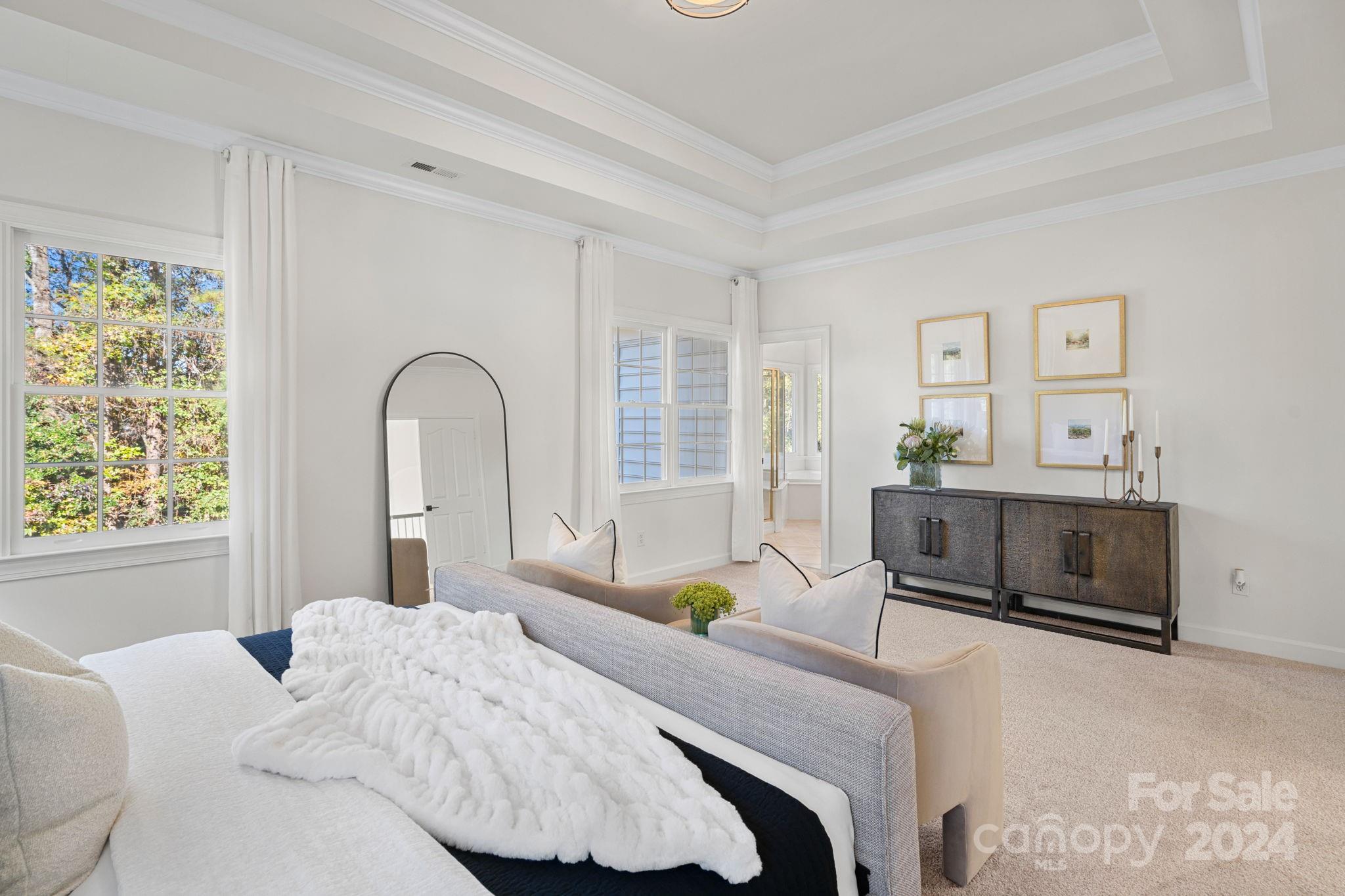3425 Rhett Butler Place Charlotte, NC 28270 - Photo 21 of 48 a bedroom with a bed a table and chair