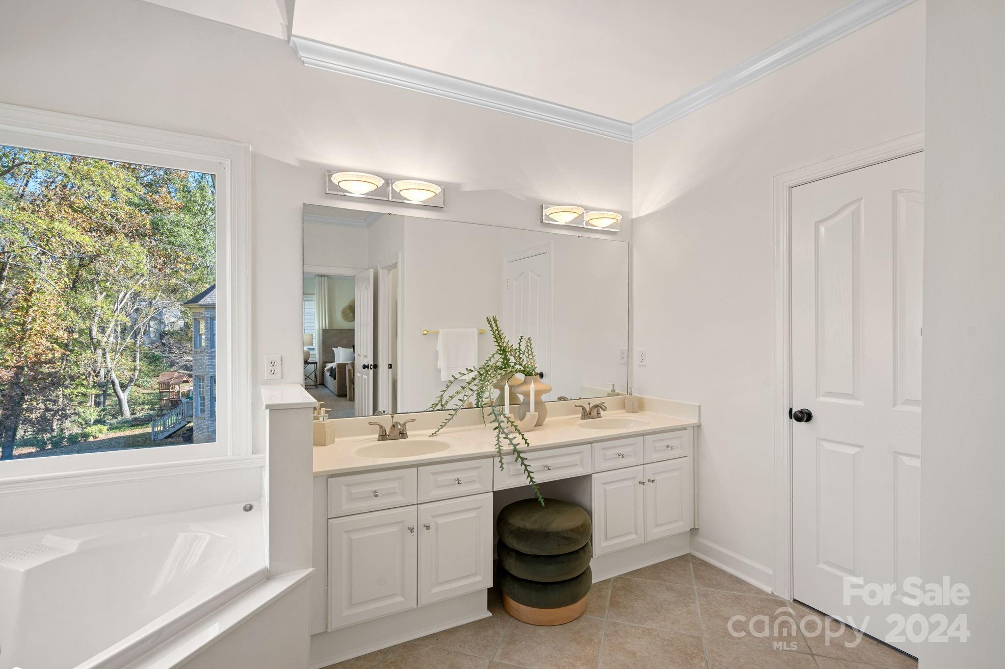 3425 Rhett Butler Place Charlotte, NC 28270 - Photo 22 of 48 a spacious bathroom with a sink double vanity and a mirror