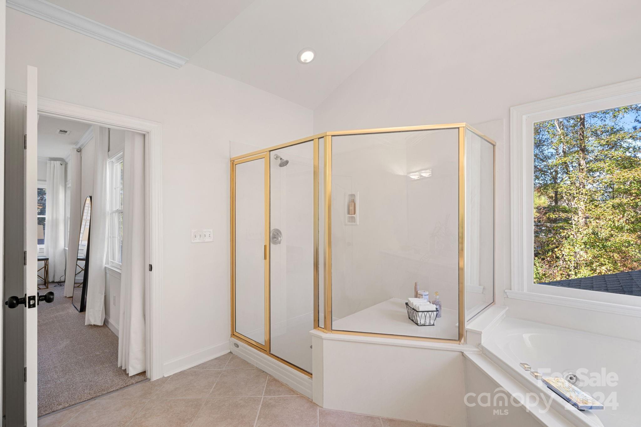 3425 Rhett Butler Place Charlotte, NC 28270 - Photo 24 of 48 a bathroom with a tub shower and sink