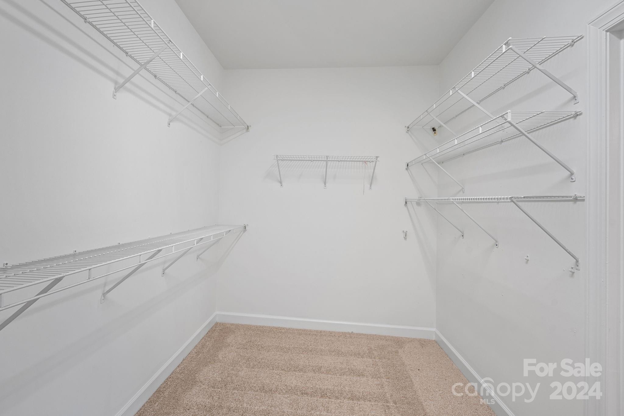 3425 Rhett Butler Place Charlotte, NC 28270 - Photo 25 of 48 a view of a room with racks on the wall