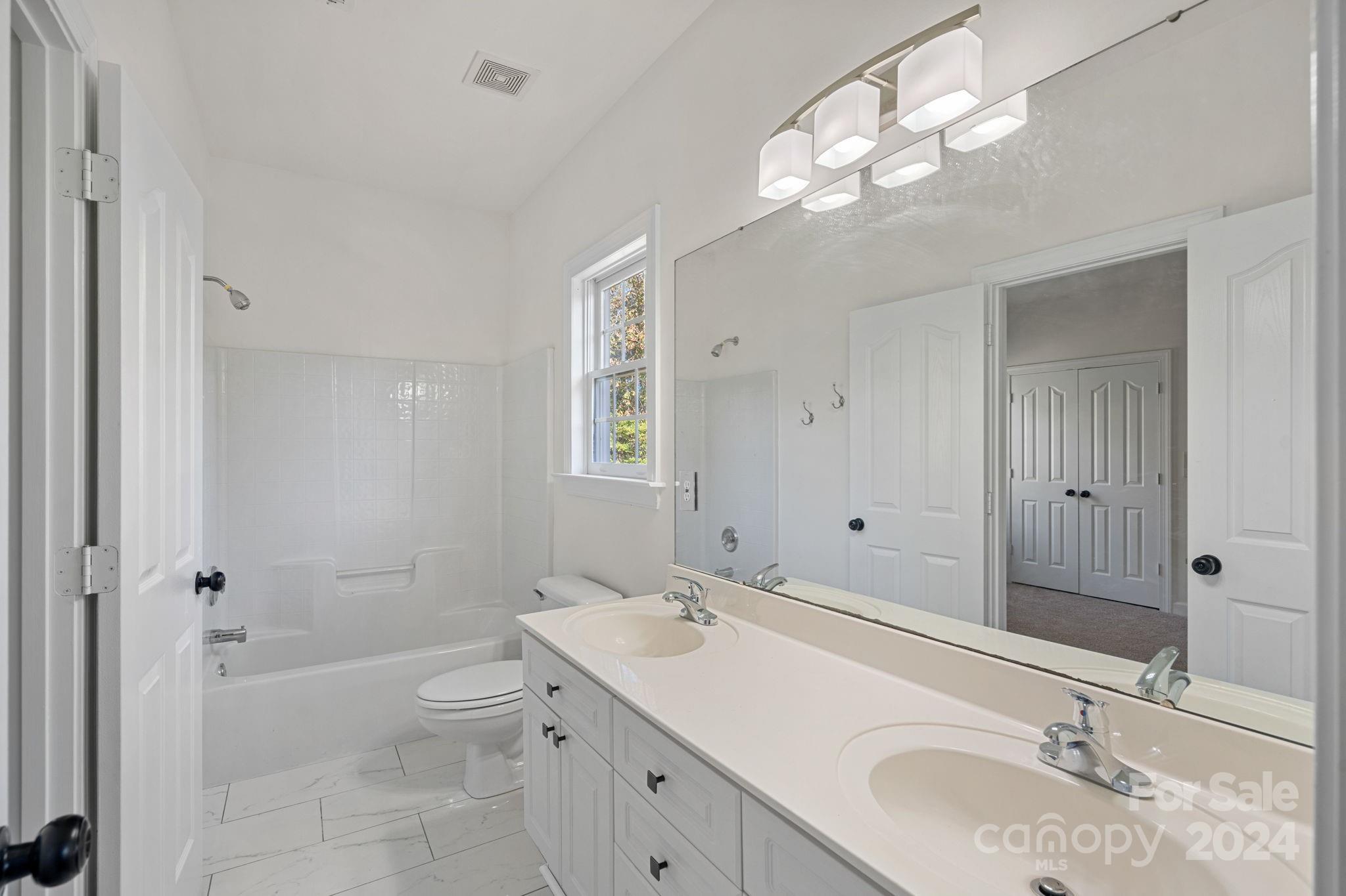 3425 Rhett Butler Place Charlotte, NC 28270 - Photo 27 of 48 a bathroom with a sink a toilet and shower
