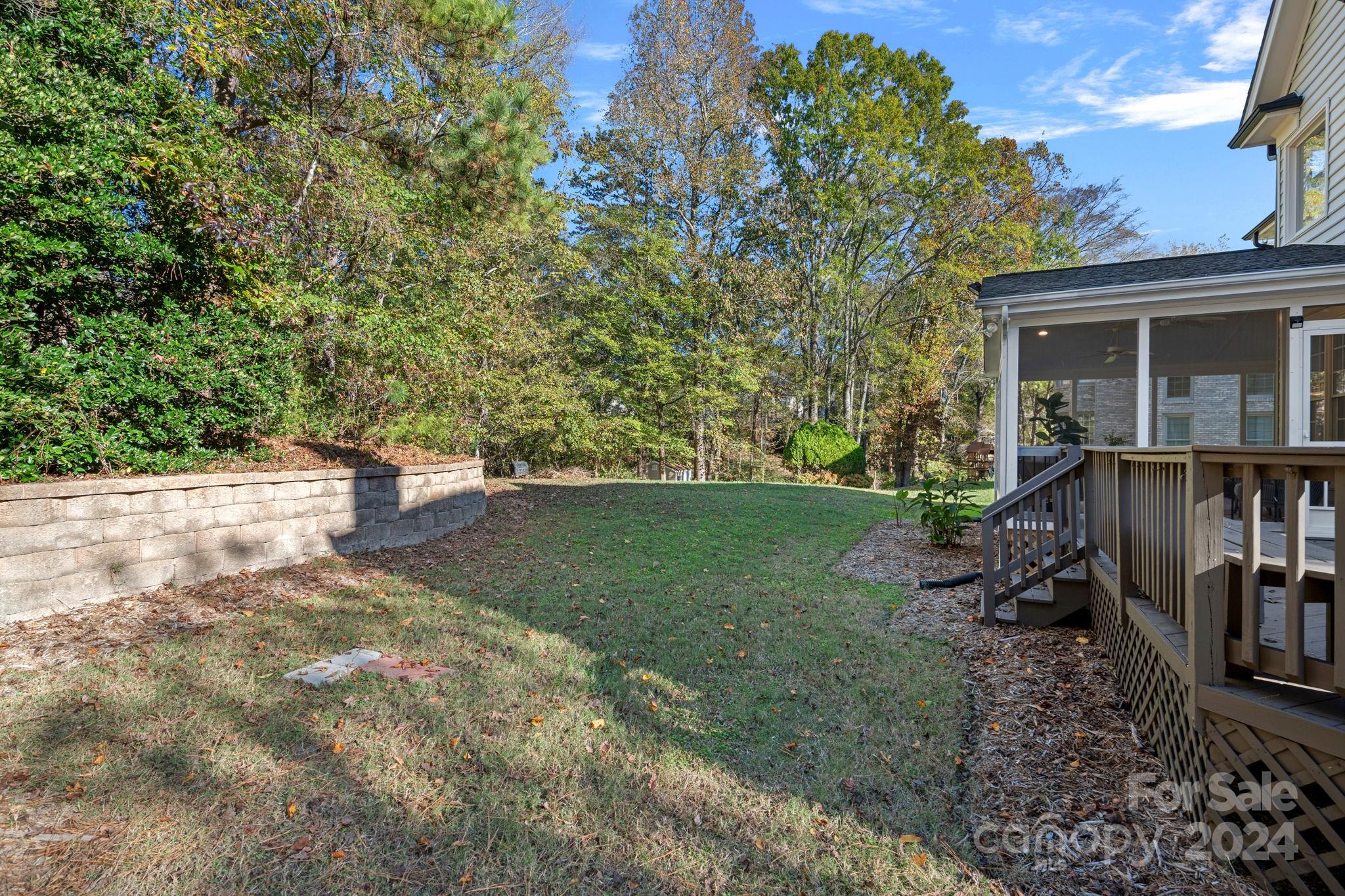3425 Rhett Butler Place Charlotte, NC 28270 - Photo 38 of 48 a view of a house with backyard and sitting area