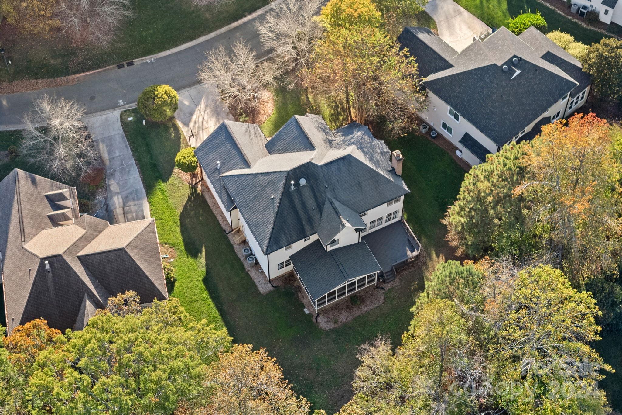 3425 Rhett Butler Place Charlotte, NC 28270 - Photo 45 of 48 a aerial view of a house with backyard and sitting area