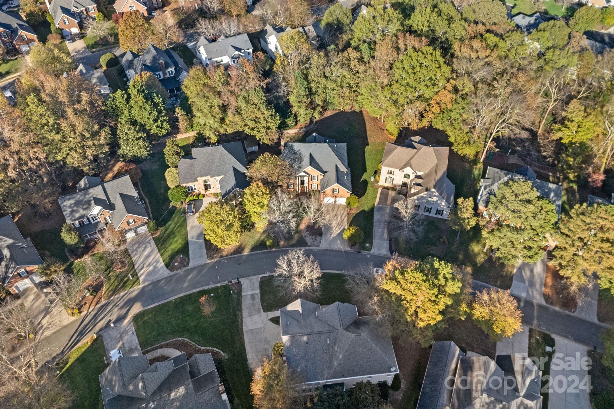 3425 Rhett Butler Place Charlotte, NC 28270 - Photo 47 of 48 an aerial view of a house with a yard and garden