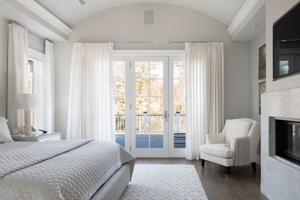 8 Hidden Road Weston, MA 02493 - Photo 19 of 42 a bedroom with a bed and a couch